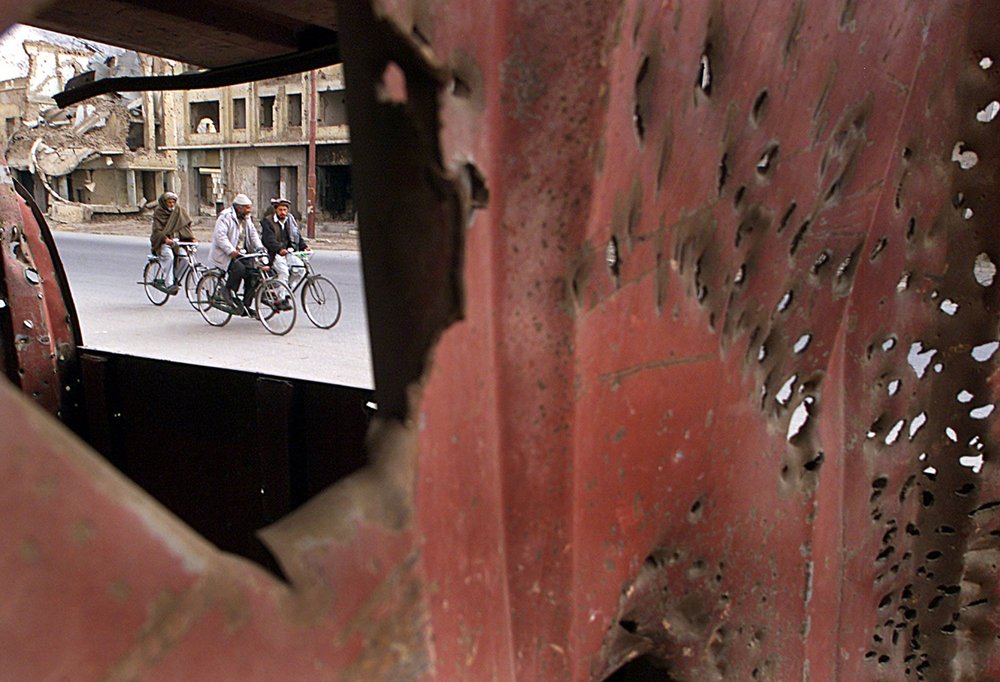 Street scene framed by damaged metal